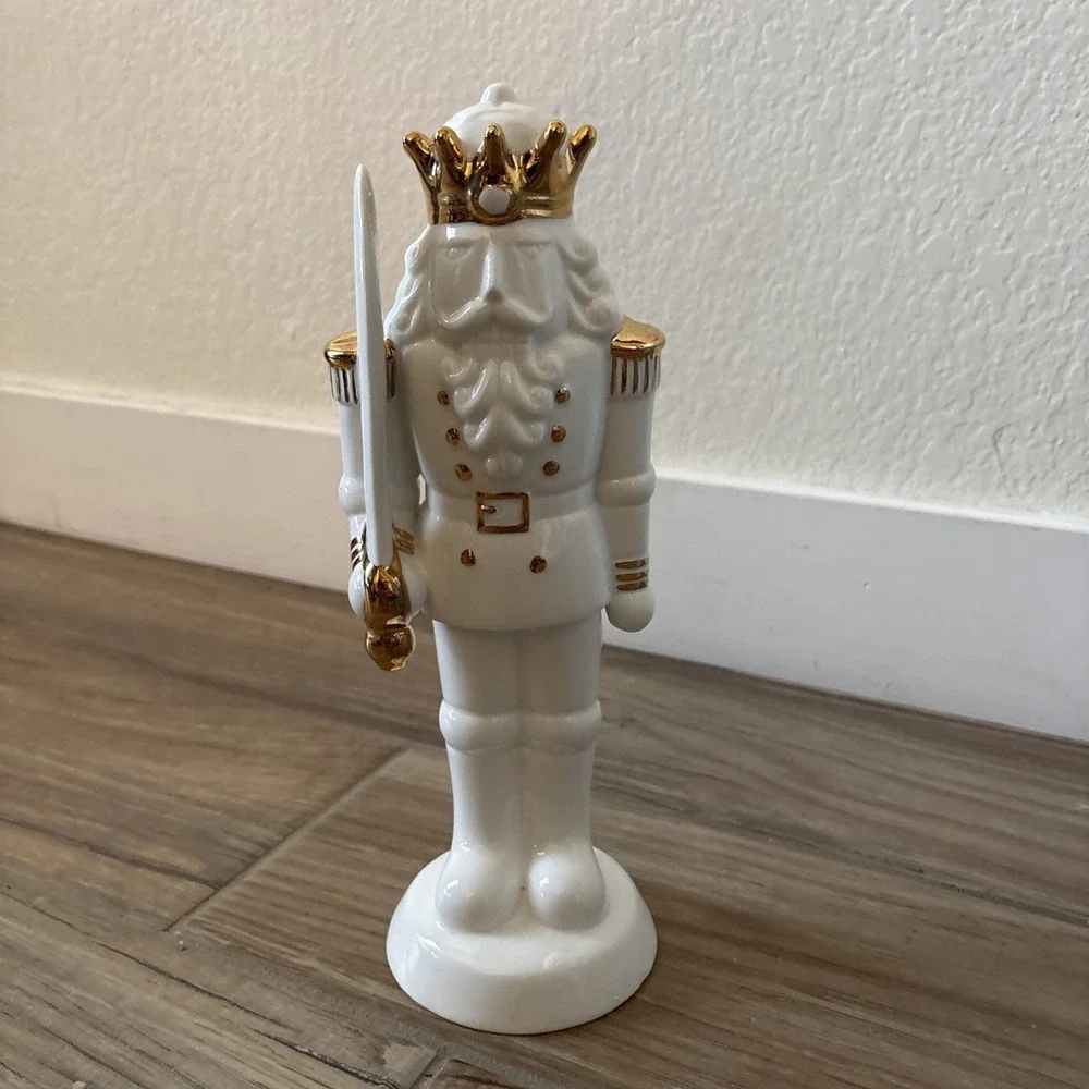 White Porcelain Nutcracker with Gold Trim Form The Holiday Aisle Figurine